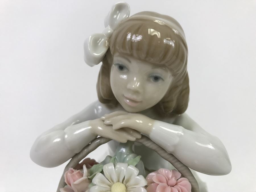 lladro dog with flowers