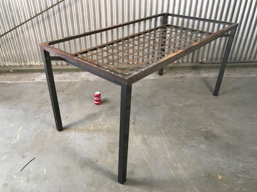 Metal Table Missing Glass Top (Note That Several Screws Are Missing) [Photo 1]