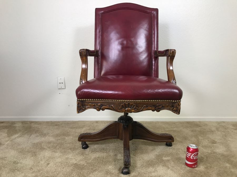 Vintage Leather And Carved Wood Executive Office Desk Chair On Casters 24'W X 22'D X 43'H [Photo 1]