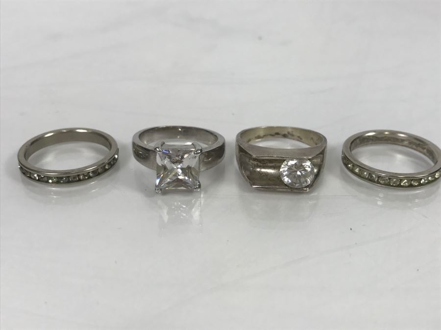 JUST ADDED - Set Of 4 Silver Tone Rings With Clear Stones [Photo 1]
