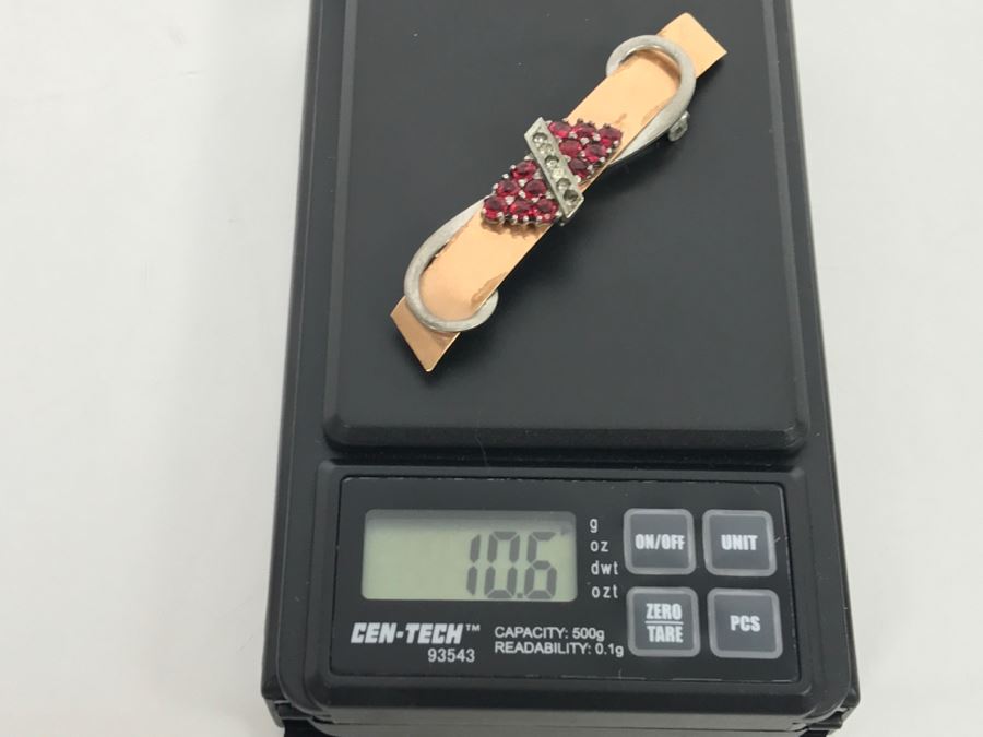 JUST ADDED - 14k Gold 2-Tone Brooch Accented With Milgrain Bar Containing 7 Clear Stones Flanked With 6 Red Prong Set Stones Ribbon Design 2.75' Long 10.6g [Photo 13]