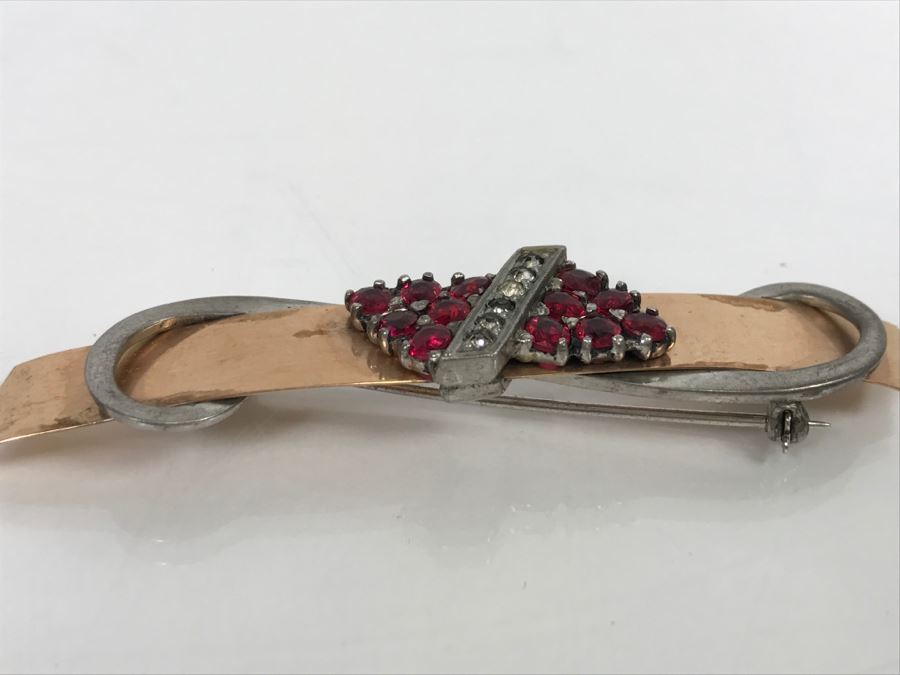JUST ADDED - 14k Gold 2-Tone Brooch Accented With Milgrain Bar Containing 7 Clear Stones Flanked With 6 Red Prong Set Stones Ribbon Design 2.75' Long 10.6g [Photo 6]