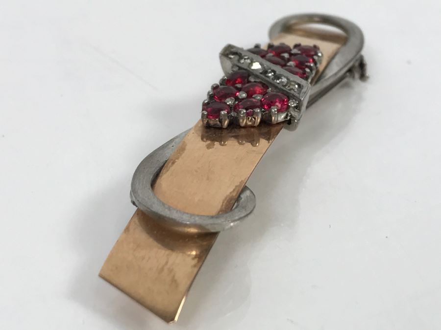 JUST ADDED - 14k Gold 2-Tone Brooch Accented With Milgrain Bar Containing 7 Clear Stones Flanked With 6 Red Prong Set Stones Ribbon Design 2.75' Long 10.6g [Photo 2]