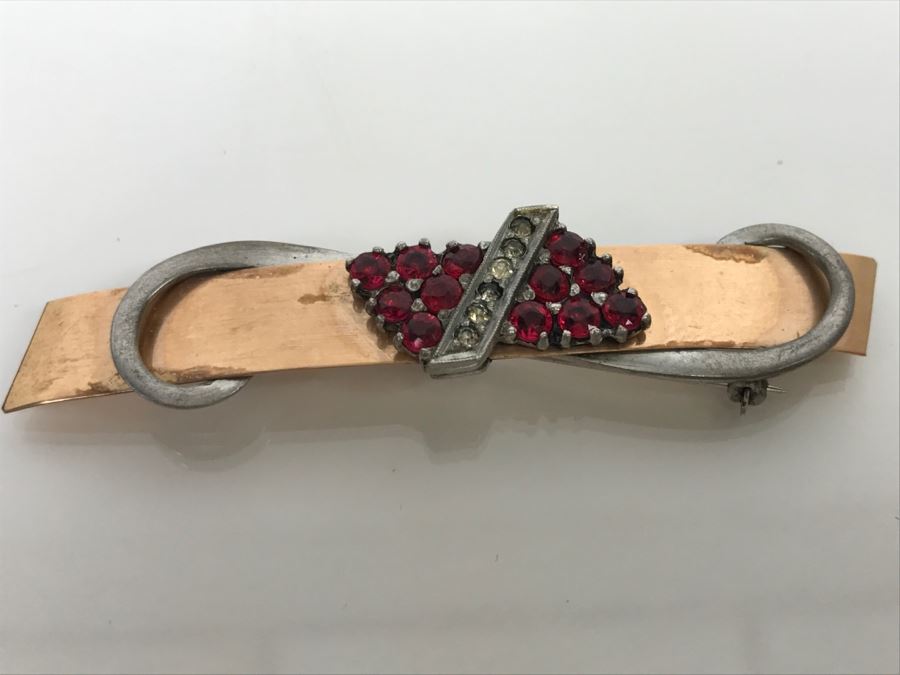 JUST ADDED - 14k Gold 2-Tone Brooch Accented With Milgrain Bar Containing 7 Clear Stones Flanked With 6 Red Prong Set Stones Ribbon Design 2.75' Long 10.6g [Photo 1]