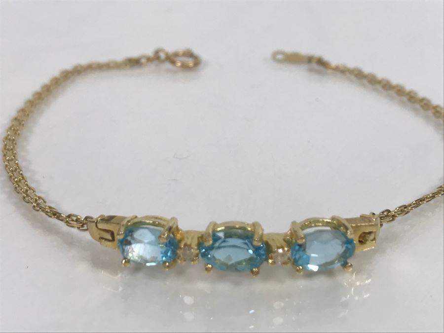 JUST ADDED - 14k Gold Bracelet With (3) Synthetic Blue Topaz Stones Accented With (2) Clear Stones 7 1/2' Long 4.2g [Photo 3]