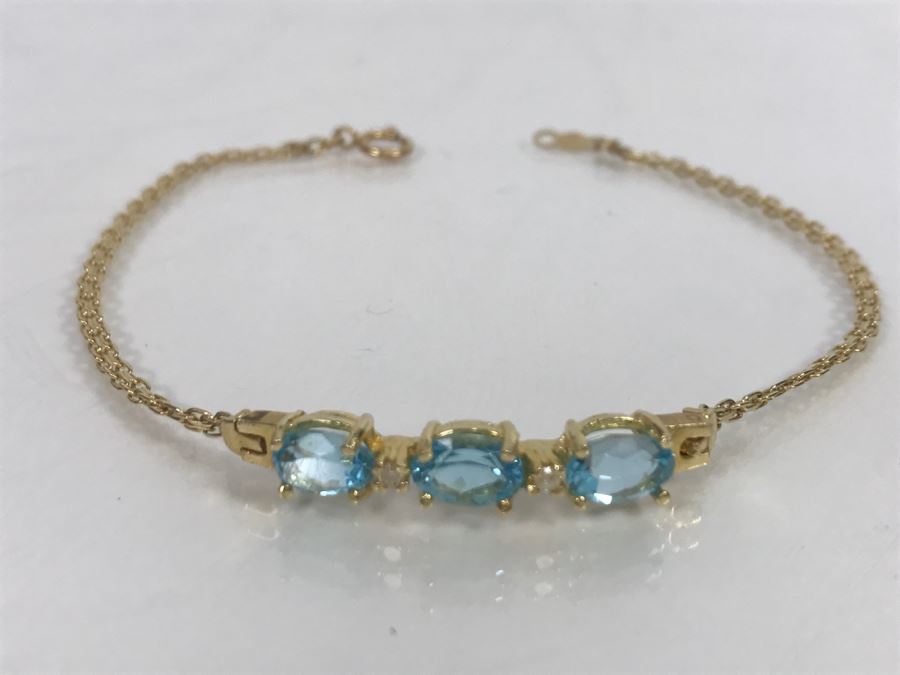 JUST ADDED - 14k Gold Bracelet With (3) Synthetic Blue Topaz Stones Accented With (2) Clear Stones 7 1/2' Long 4.2g [Photo 2]