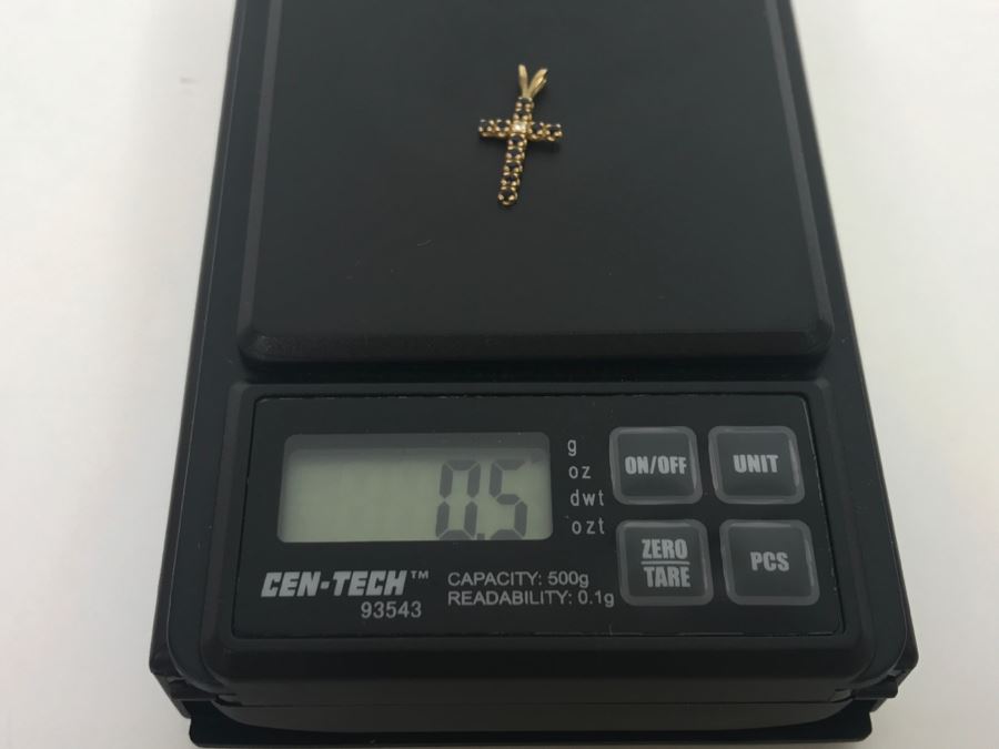 JUST ADDED - 14k Yellow Gold Cross With (11) Prong Set Saphire Like Stones And Clear Stone In Center Split Bale 3/4'L 0.5g [Photo 11]