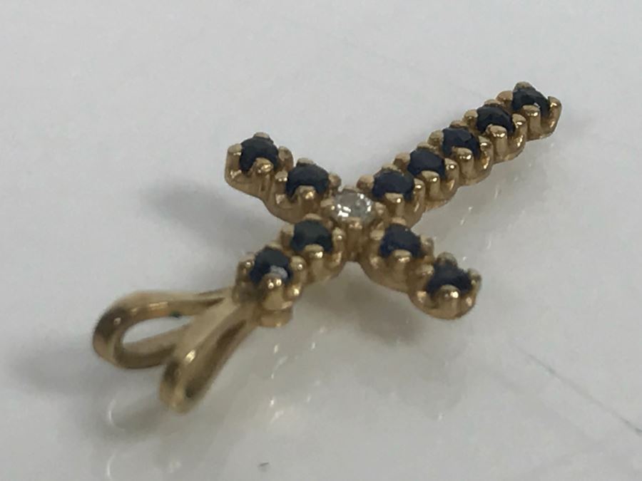 JUST ADDED - 14k Yellow Gold Cross With (11) Prong Set Saphire Like Stones And Clear Stone In Center Split Bale 3/4'L 0.5g [Photo 7]