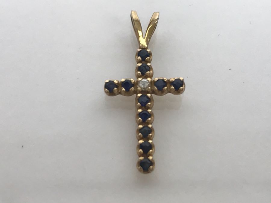 JUST ADDED - 14k Yellow Gold Cross With (11) Prong Set Saphire Like Stones And Clear Stone In Center Split Bale 3/4'L 0.5g [Photo 2]
