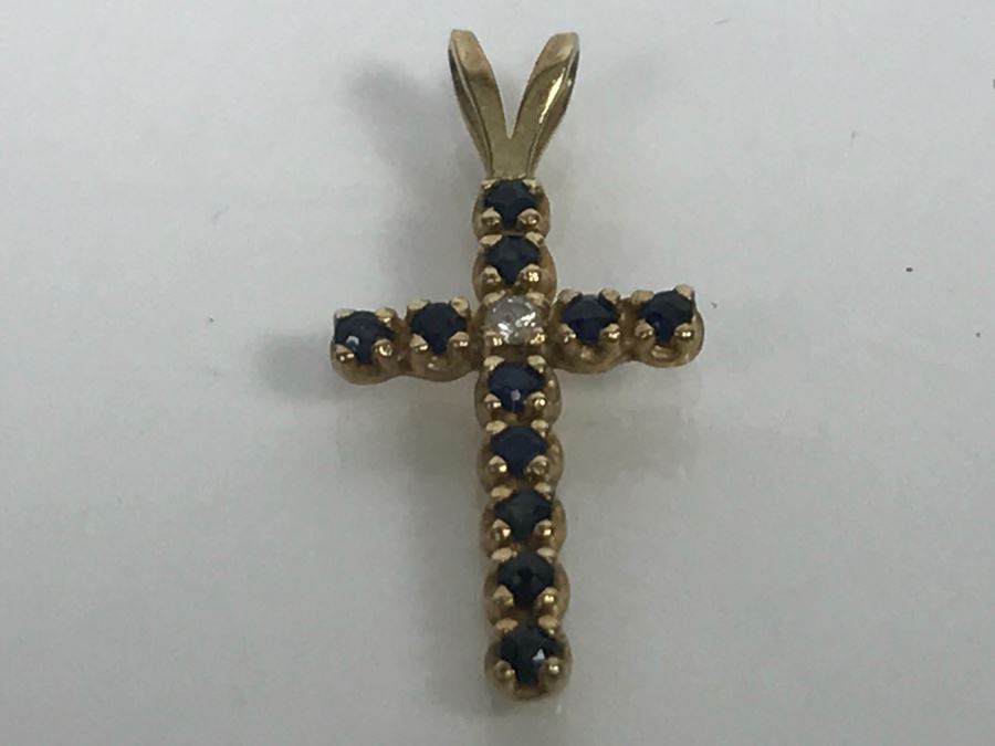 JUST ADDED - 14k Yellow Gold Cross With (11) Prong Set Saphire Like Stones And Clear Stone In Center Split Bale 3/4'L 0.5g [Photo 3]