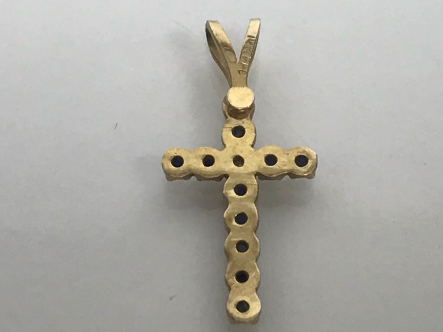 JUST ADDED - 14k Yellow Gold Cross With (11) Prong Set Saphire Like Stones And Clear Stone In Center Split Bale 3/4'L 0.5g [Photo 8]