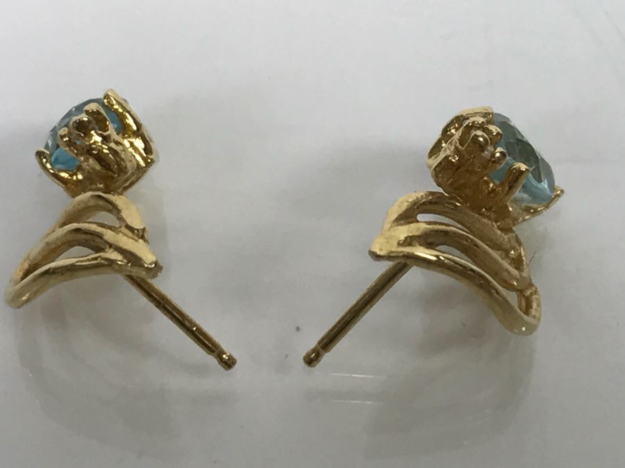 JUST ADDED - 14k Gold Oval Stud Earrings 4 Prong Set With Light Blue Stones Accented With Small 4 Prong Clear Stone With Yellow Gold Fluting 2.3g [Photo 4]