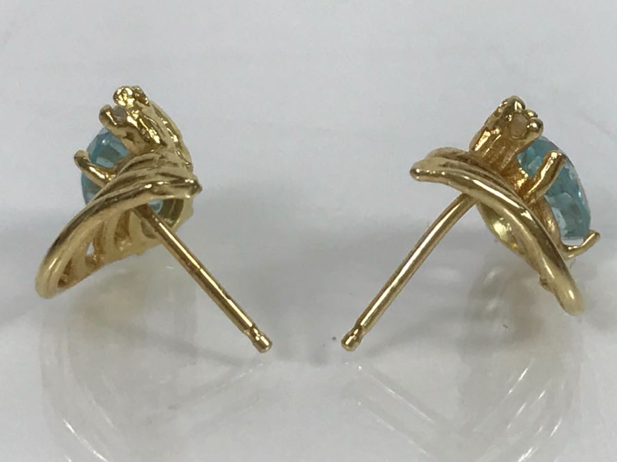 JUST ADDED - 14k Gold Oval Stud Earrings 4 Prong Set With Light Blue Stones Accented With Small 4 Prong Clear Stone With Yellow Gold Fluting 2.3g [Photo 3]