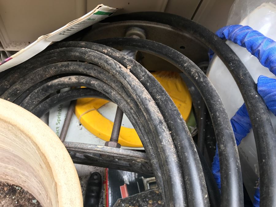 Suncast Plastic Outdoor Storage Container With Various Gardening Supplies Including Pots [Photo 12]