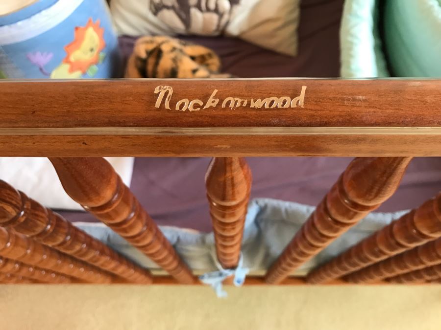 Vintage Wooden Nockonwood Baby Drop Side Crib With Various Baby Crib Bumbers, Bedding, And Other Items Photographed In Crib [Photo 11]