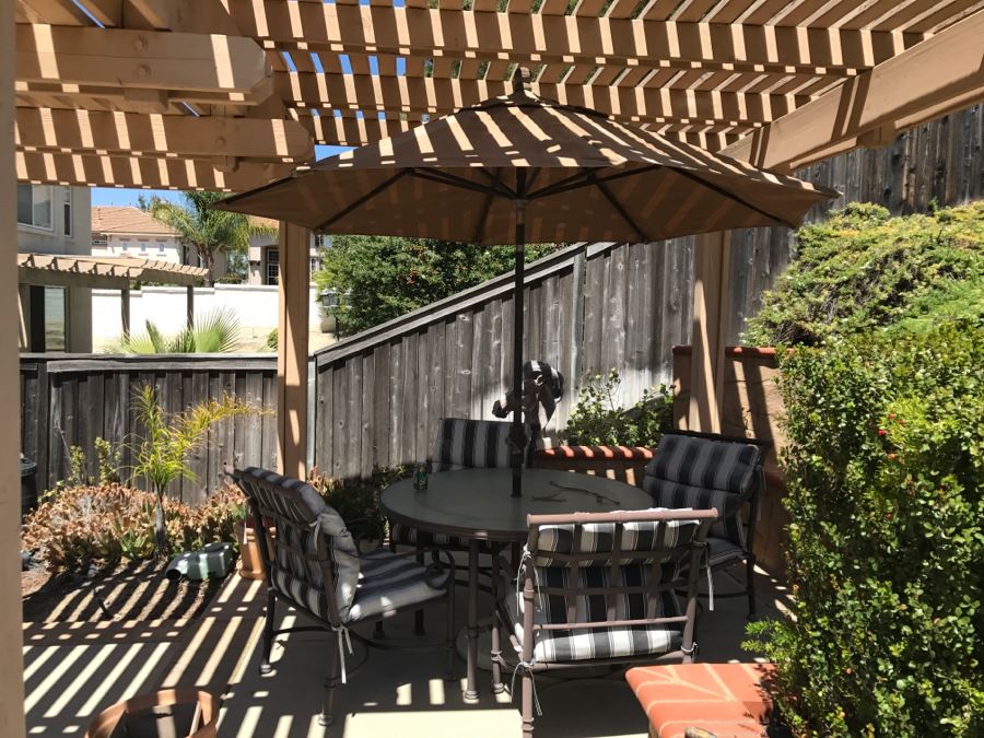 Outdoor Patio Table With Four Chairs And Umbrella 48'R [Photo 1]