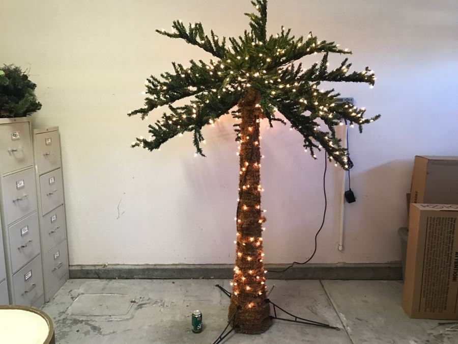 Lighted artificial palm tree with built in stand