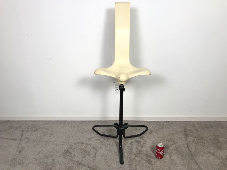 Mid-Century Modern Saddle High Back Fiberglass Chair Possibly Used As Chair For Posing Model [Photo 1]