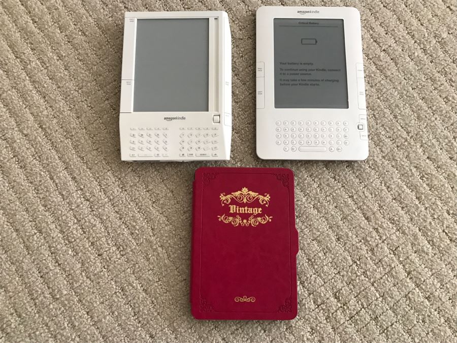 JUST ADDED - Set Of (3) Older Amazon Kindles With Vintage Kindle Case (Not Sure If Any Are Working) [Photo 2]