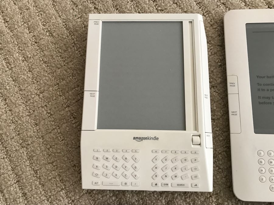 JUST ADDED - Set Of (3) Older Amazon Kindles With Vintage Kindle Case (Not Sure If Any Are Working) [Photo 7]