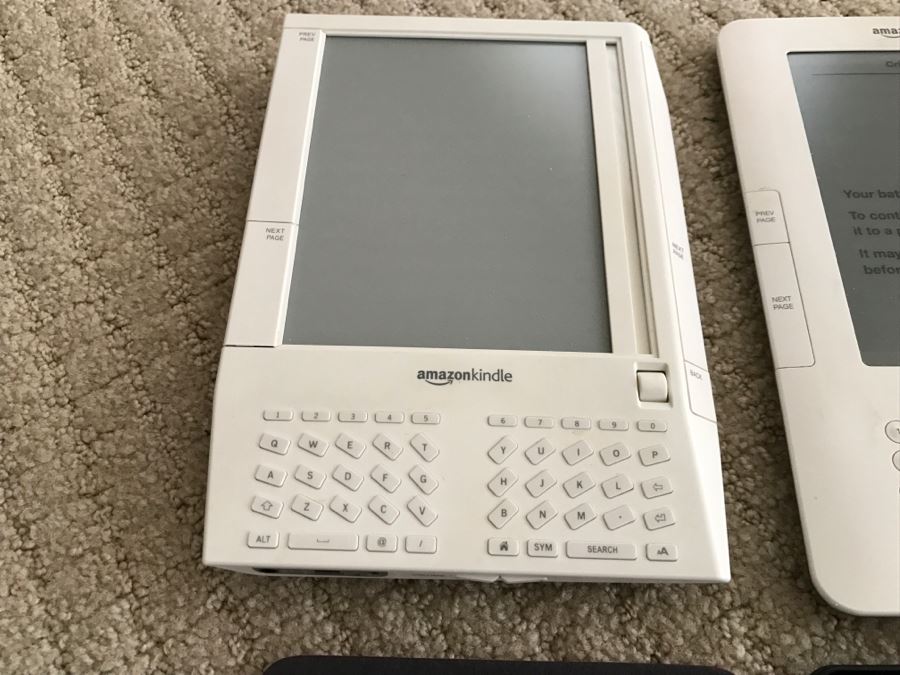 JUST ADDED - Set Of (3) Older Amazon Kindles With Vintage Kindle Case (Not Sure If Any Are Working) [Photo 8]