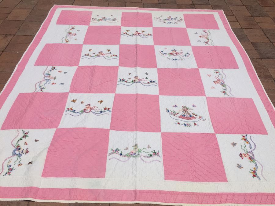 Vintage Pink And White Quilt With Detailed Stitching Of Woman Surrounded By Flowers And Butterflies [Photo 1]