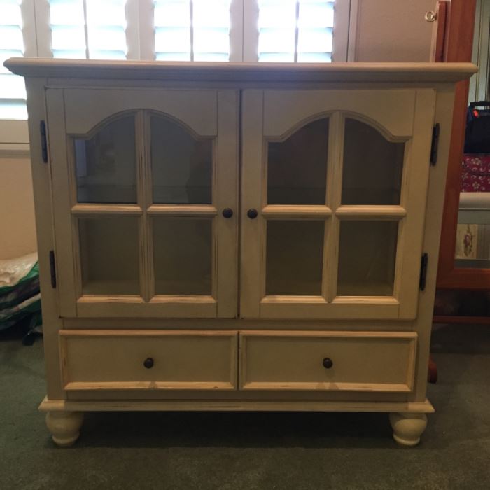 White Distressed Cabinet With Glass Window Doors 32'W X 12'D X 30'H [Photo 1]