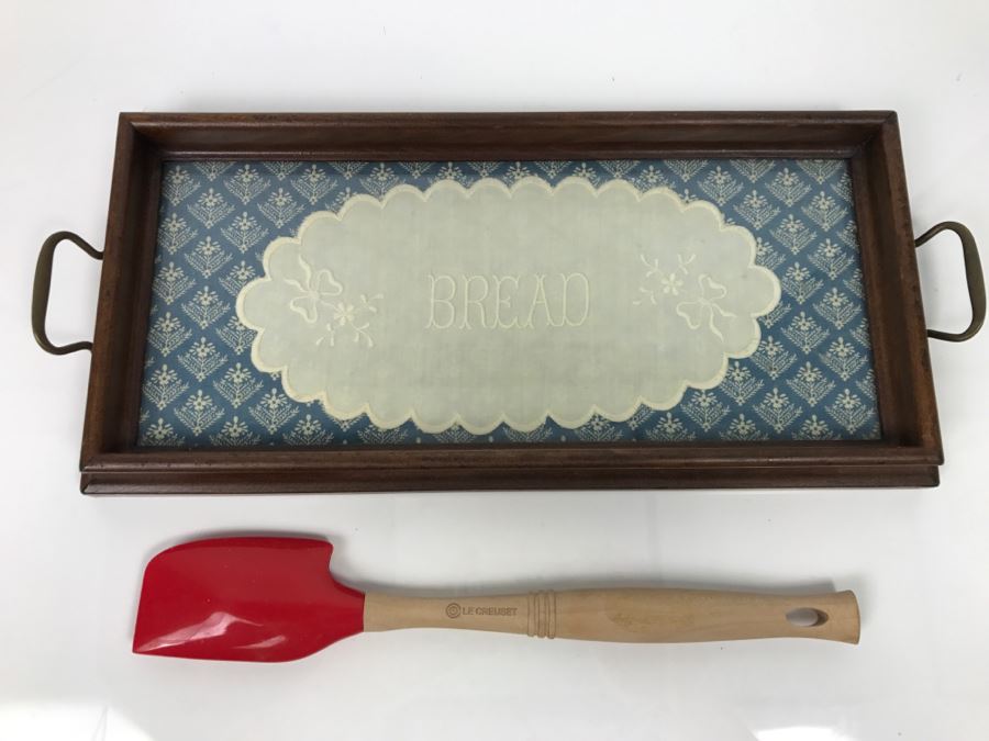 Wooden Bread Serving Tray With Bread Embroidery Under Glass And Le Creuset Utensil