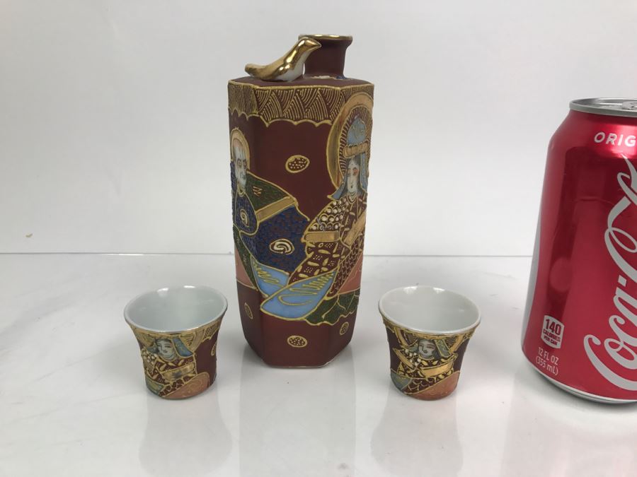 Hand Painted Japanese Sake Set With Faces Of Women Visible At Bottom Of Cups