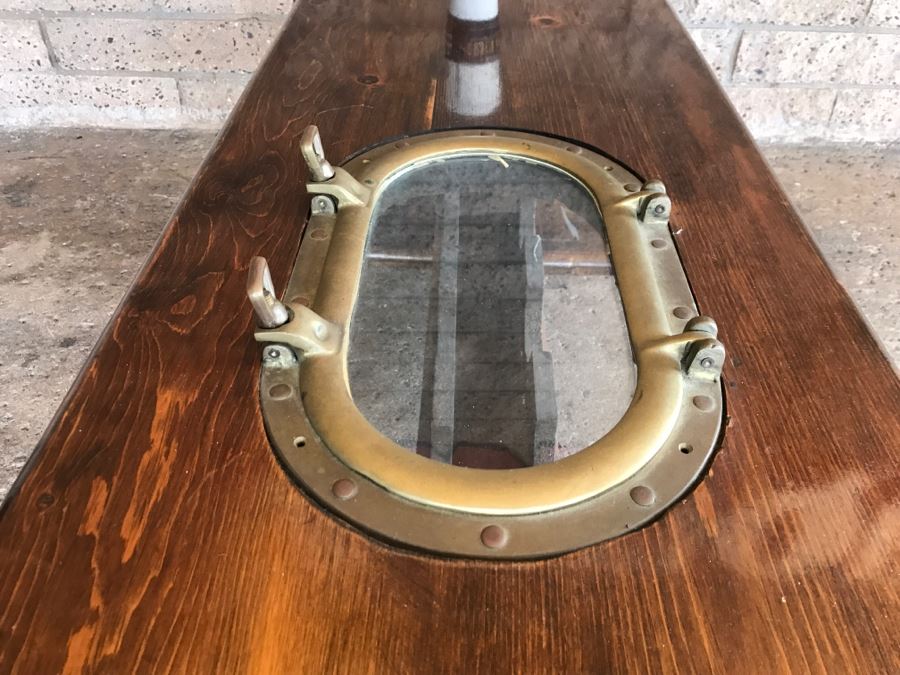 Wooden Coffee Table With Vintage Brass Ships Porthole And Storage For 5 Wine Bottle Below Table [Photo 2]
