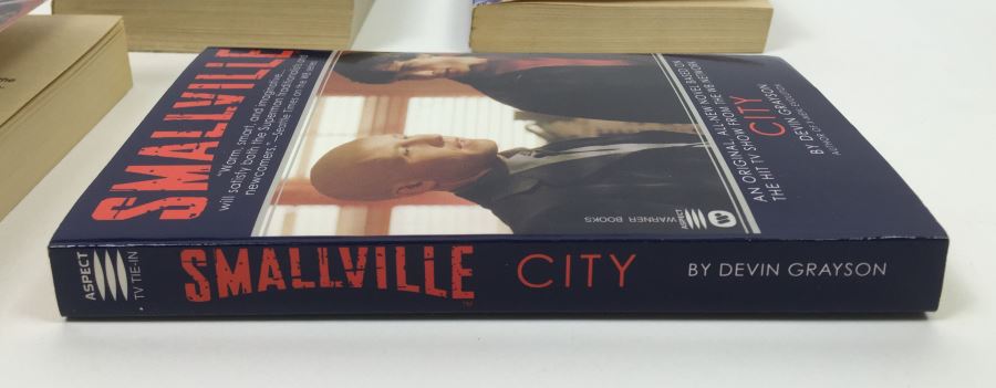 Dome - Signed by Steve Perry & Michael Reeves; The Trinity Paradox - Signed by Doug Beason & Kevin J. Anderson; The Fugitive Worlds by Bob Shaw; Smallville (x2) - Signed by Devin Grayson (x2) [Photo 26]