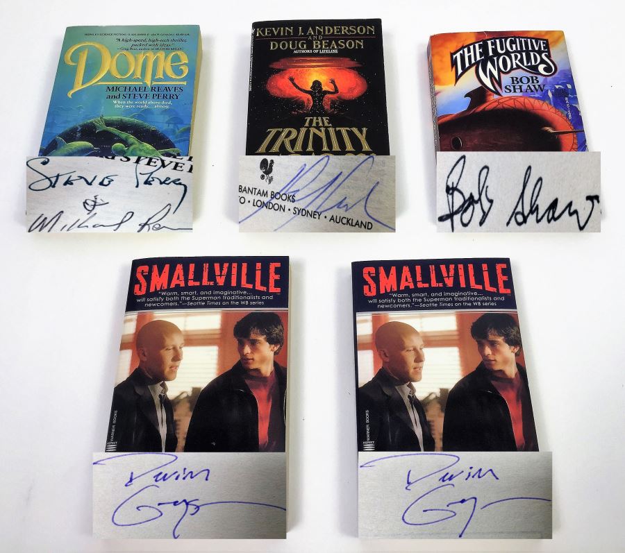 Dome - Signed by Steve Perry & Michael Reeves; The Trinity Paradox - Signed by Doug Beason & Kevin J. Anderson; The Fugitive Worlds by Bob Shaw; Smallville (x2) - Signed by Devin Grayson (x2) [Photo 1]