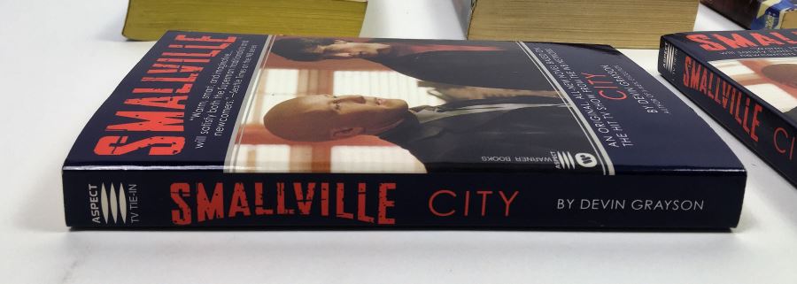 Dome - Signed by Steve Perry & Michael Reeves; The Trinity Paradox - Signed by Doug Beason & Kevin J. Anderson; The Fugitive Worlds by Bob Shaw; Smallville (x2) - Signed by Devin Grayson (x2) [Photo 21]