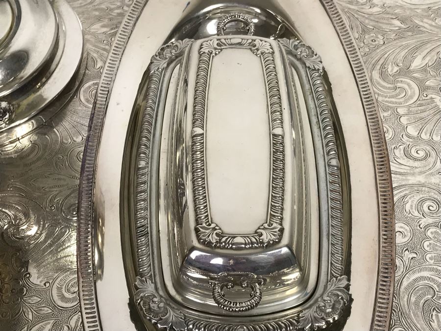 Collection Of Silverplate Serving Pieces Including Large Ornate Chased Tray, Gravy Train, Covered Butter Dishes And Shell Tray [Photo 9]