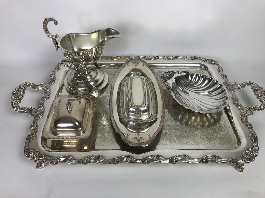 Collection Of Silverplate Serving Pieces Including Large Ornate Chased Tray, Gravy Train, Covered Butter Dishes And Shell Tray [Photo 1]