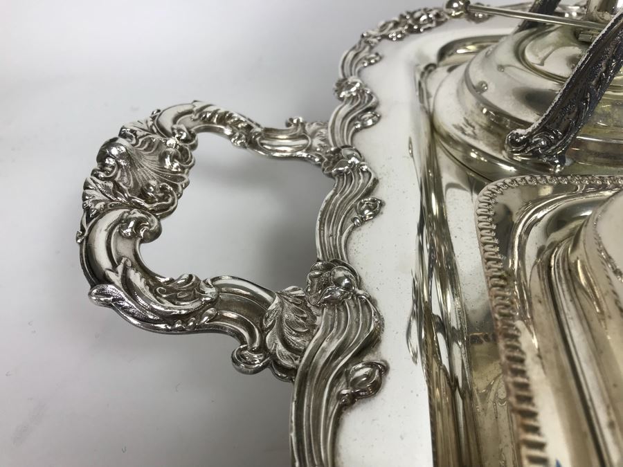 Collection Of Silverplate Serving Pieces Including Large Ornate Chased Tray, Gravy Train, Covered Butter Dishes And Shell Tray [Photo 5]