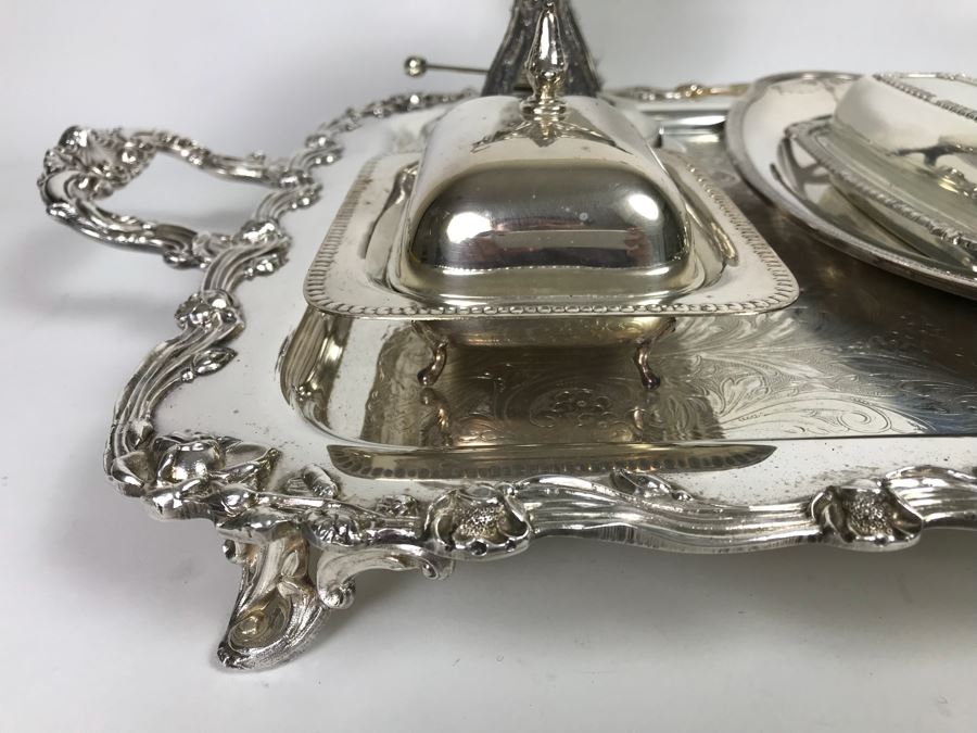 Collection Of Silverplate Serving Pieces Including Large Ornate Chased Tray, Gravy Train, Covered Butter Dishes And Shell Tray [Photo 4]