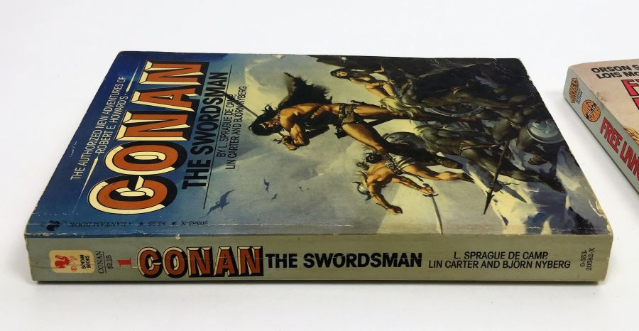 Conan the Swordsman - Signed by L. Sprague de Camp; Free Lancers - Signed by Lois McMaster Bujold; Tales from the Spaceport Bar - Signed by Larry NIven, L. Sprague de Camp, Steven Barnes, Spider Robinson, Robert Silverberg, Barry B. Longyear, etc. [Photo 3]