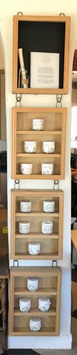 Wall Mounted Hooked Shelving Boxes Filled With New Products From Holbrook Candle Co - See Photos
