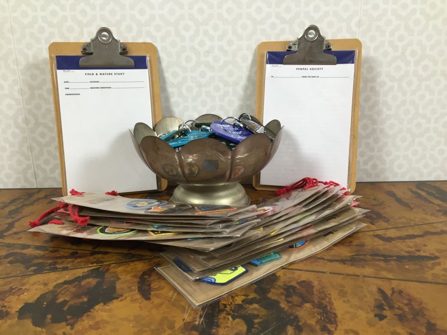 JUST ADDED - Pair Of Notepads With Clipboards, Silverplate Trophy Bowl Filled With Motel Keychains And Questionable Merit Badge Patches [Photo 1]