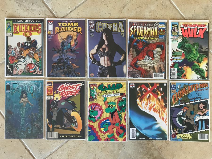 (10) Vintage Comic Books Including Fathom #1, Ghost Rider #1, Earth X #1, Elongated Man #1, The Rampaging Hulk #1, Tomb Raider #1, Peter Parker Spider-Man #1 [Photo 1]