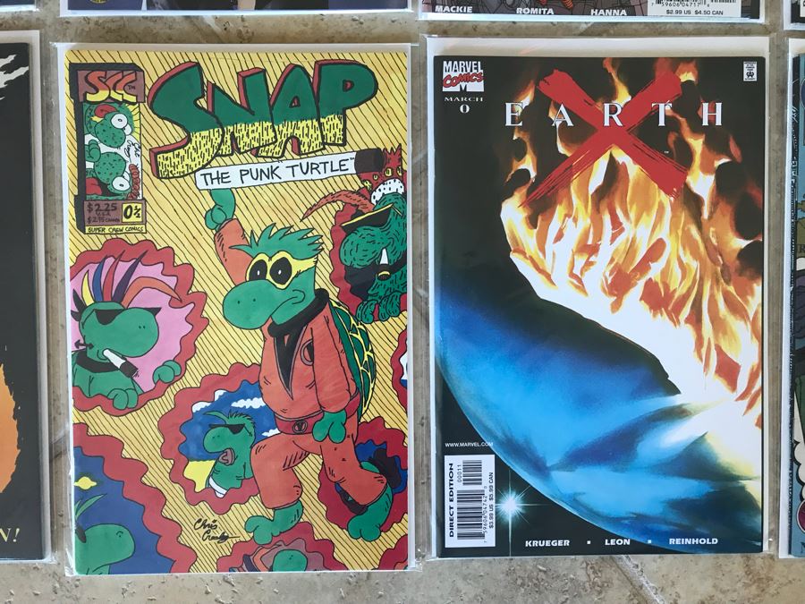 (10) Vintage Comic Books Including Fathom #1, Ghost Rider #1, Earth X #1, Elongated Man #1, The Rampaging Hulk #1, Tomb Raider #1, Peter Parker Spider-Man #1 [Photo 6]