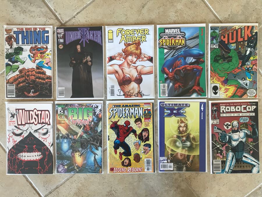 (10) Vintage Comic Books Including RoboCop #1, SIGNED Forever Amber #1, Undertaker #1, The Amazing Spider-Man #1, WildStar #1, Ant Man's Big Christmas #1 [Photo 1]