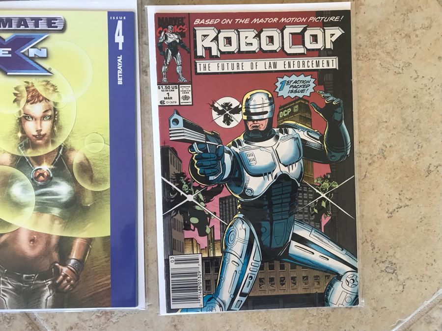 (10) Vintage Comic Books Including RoboCop #1, SIGNED Forever Amber #1, Undertaker #1, The Amazing Spider-Man #1, WildStar #1, Ant Man's Big Christmas #1 [Photo 8]