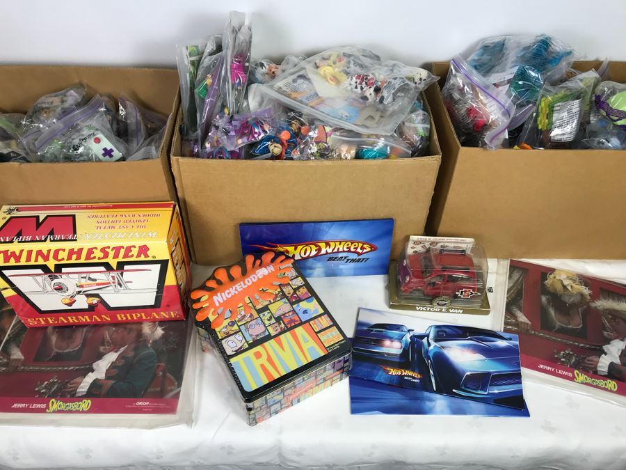 Box filled with collectible McDonald's and Burger King Happy Meal Toys 