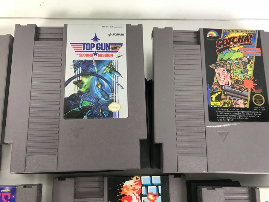 (11) Vintage Nintendo Video Games Incl California Games, Top Gun, Tetris, Thrilla's Surfari And Game Genie Video Game Enhancer With (4) Nintendo Video Game Controllers [Photo 10]