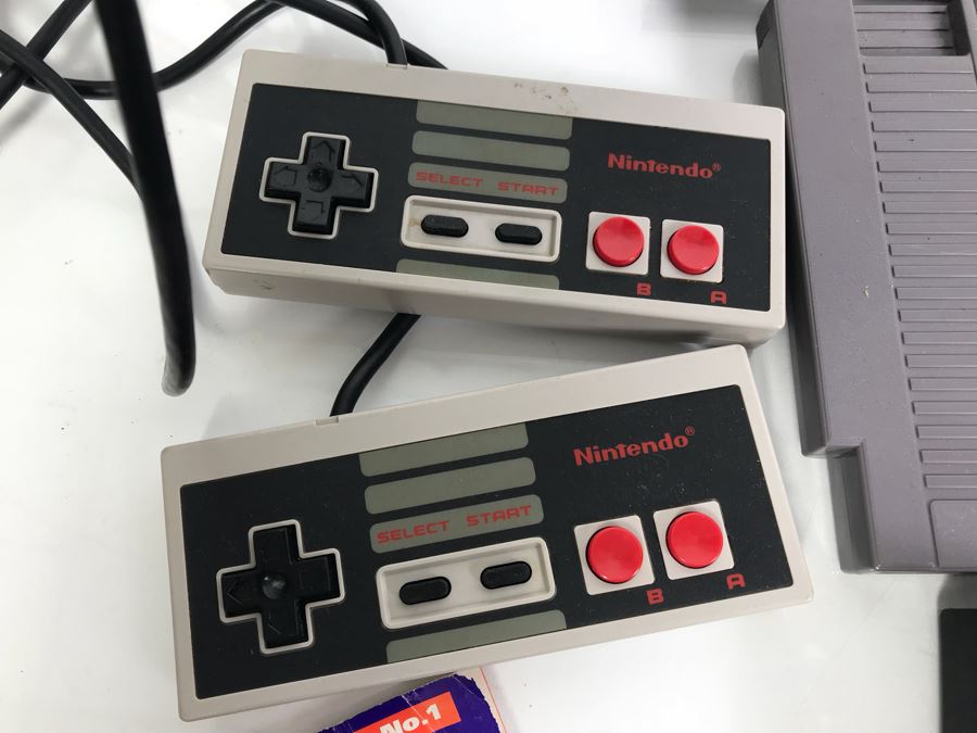 (11) Vintage Nintendo Video Games Incl California Games, Top Gun, Tetris, Thrilla's Surfari And Game Genie Video Game Enhancer With (4) Nintendo Video Game Controllers [Photo 11]