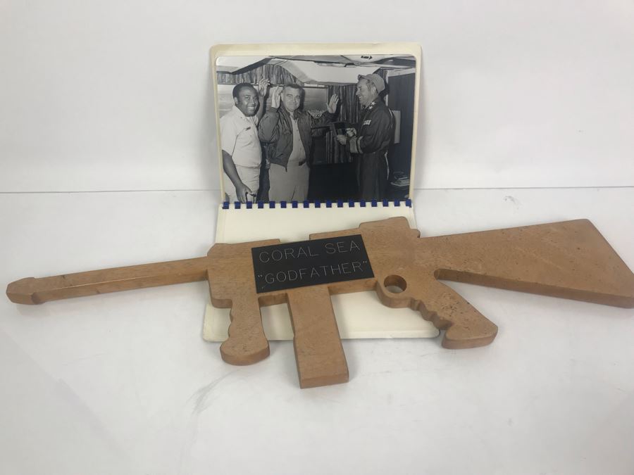 Carved Wooden Gun With Inscription 'Coral Sea Godfather' And Photograph Book Titled 'To The Coral Sea Godfather From The Coral Sea Family' Recognizing William H. Harris, RADM, USN (Ret.) [Photo 1]