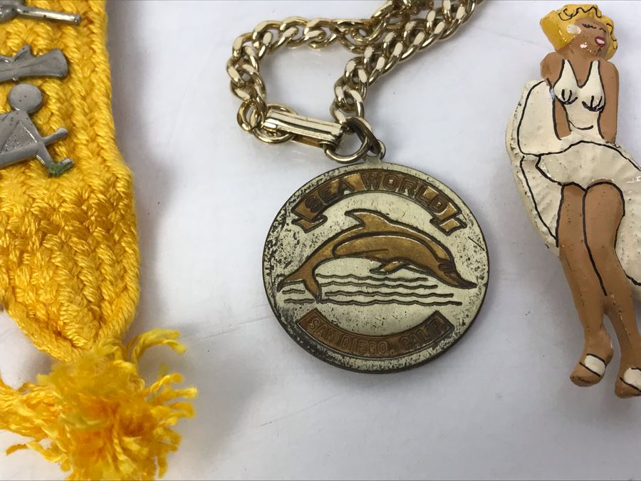 Collectibles Lot With Pins, Patches, Keychains, Bracelet Includes Airline Wings, Marilyn Monroe Brooch, Webelos, Girl Scouts, Trojans Football Brooch, USN, Snow White, Wells Fargo - See Photos [Photo 26]