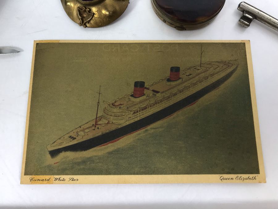 Vintage Lot Featuring An English Boatswain Whistle, Hand Wrought Bird Tray, 1946 Maiden Voyage Postcard Of Queen Elizabeth Ship, Vintage Brooch Pin, Ladies Compact, 3 Rings, Lacquer Box, Metal Box, Token, Copper Chalice And Mini Pocket Knife - See Photos [Photo 3]